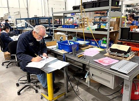 Ben Machine employees on the manufacturing floor